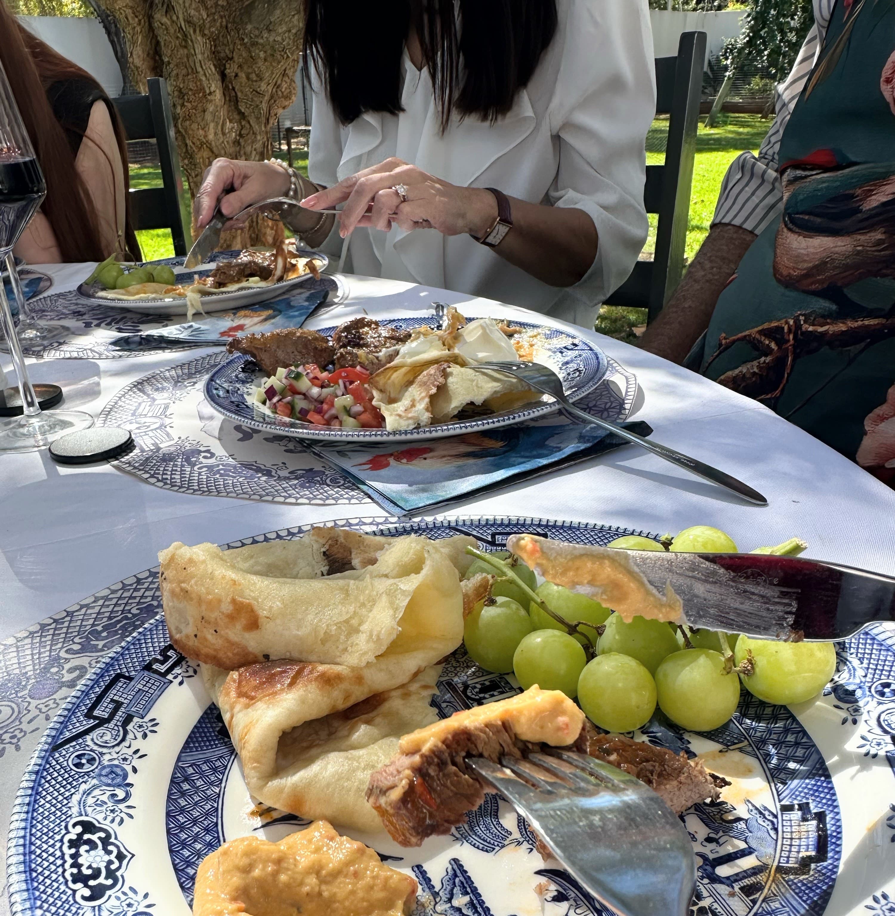 Quince jelly on a wooden board and next to a copper bucket